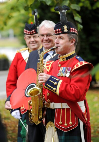 Mr Ross pictured with director of Music, Major James Marshall and Warrant Officer John McQuat of the Royal Regiment of Scotland outside Inverness Cathedral.