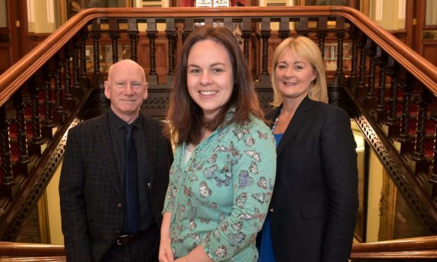 Kate Forbes with Yvonne Crook from Highland Tourism CIC and George Baxter, from GreenPower Image Sandy McCook/DC Thomson