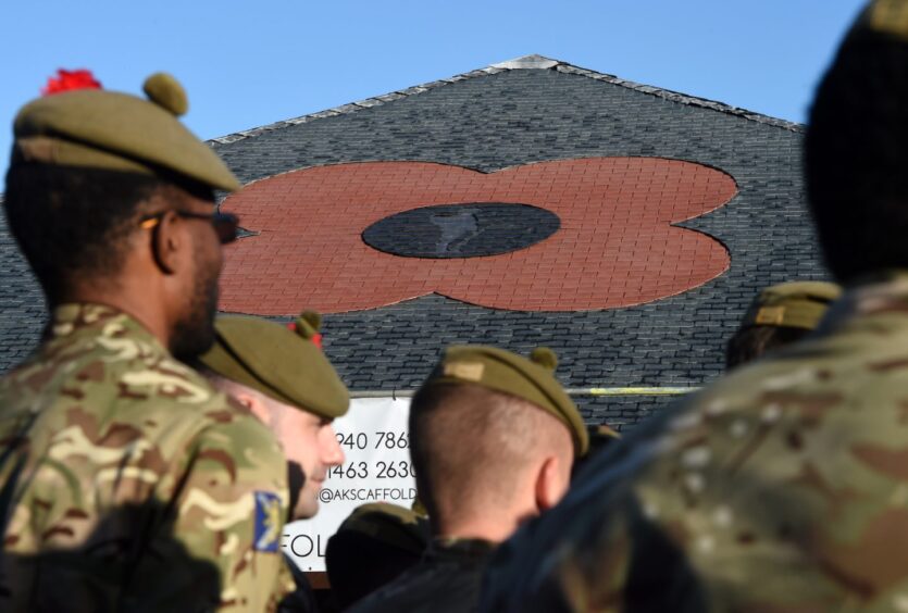A poppy motif has been built in to the slated roof of a facilities building at Cameron Barracks.