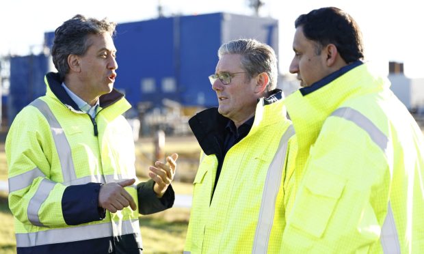 Labour leader Sir Keir Starmer (centre), Scottish Labour leader Anas Sarwar (right) and Ed Miliband, Shadow Energy Security and Net Zero Secretary (left), during a visit to St Fergus Gas Terminal, a clean power facility in Aberdeenshire. Picture date: Friday November 17, 2023. PA Photo. See PA story POLITICS Starmer. Photo credit should read: Jeff J Mitchell/PA Wire