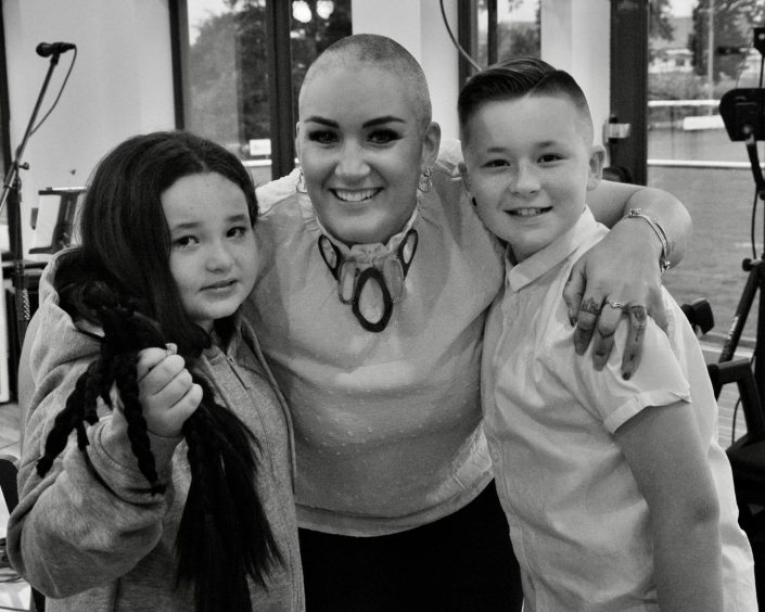 Jade Taylor after shaving her hair for charity alongside her daughter Giah, eight and son Kaiden, 11.