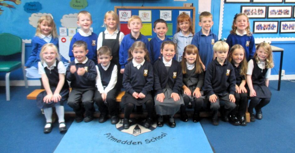 Aberdeenshire's Pitmedden Primary School pupils smiling at the camera for their First Class 2023 photo