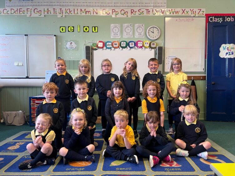 First class of 2023 at Portsoy Primary School in Aberdeenshire lined up in three rows in their classroom