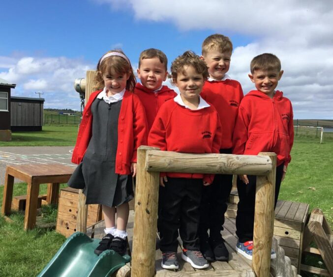 Reay Primary School's first class of 2023 in the playground of the highlands and islands school