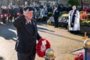 A veteran pays his respects at the Remembrance Day parade in Buckie. Image: Jasperimage
