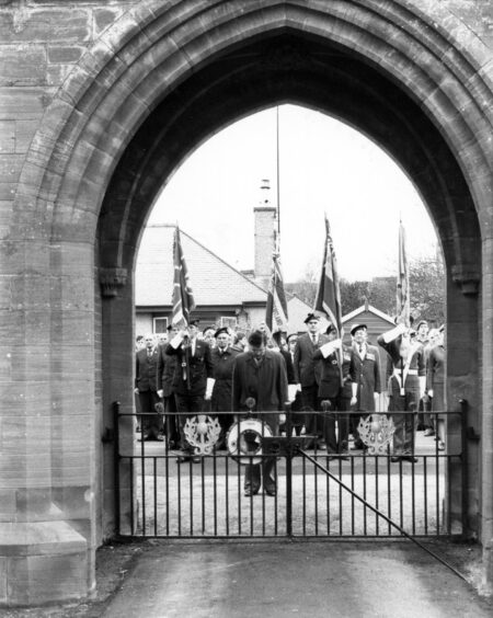 Picture shows; People gather at Turriff memorial gate. Turriff. Supplied by DCT Archives.