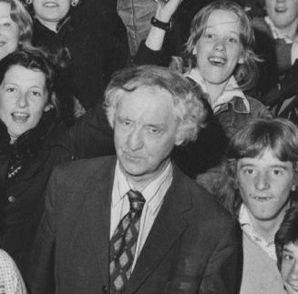 Cheers from pupils of Aberdeen's Summerhill Academy as their former headmaster, Mr RF Mackenzie, receives his retirement presentation in 1975.