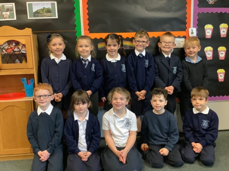 First class of 2023 at Rockfield Primary school in the highlands and islands, the pupils at in two rows in their classroom