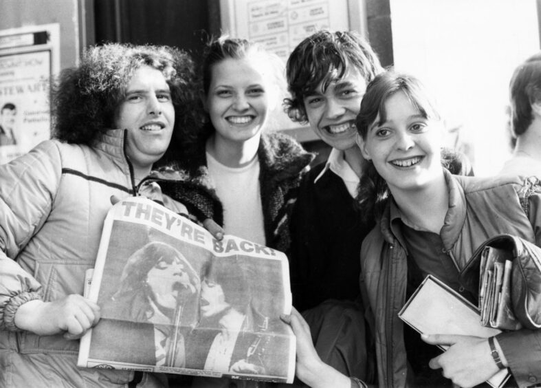 Fans show their excitement to photographers before the stars arrive. Supplied by DCT Archives.