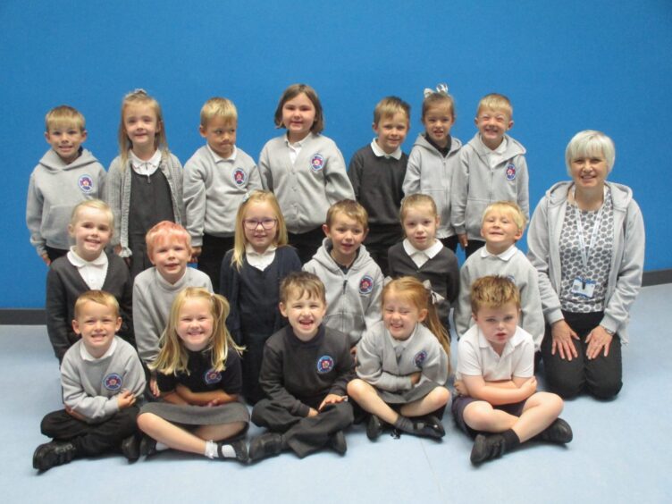 Rosehearty School primary 1 pupils with Mrs J Hutton kneeling next to them