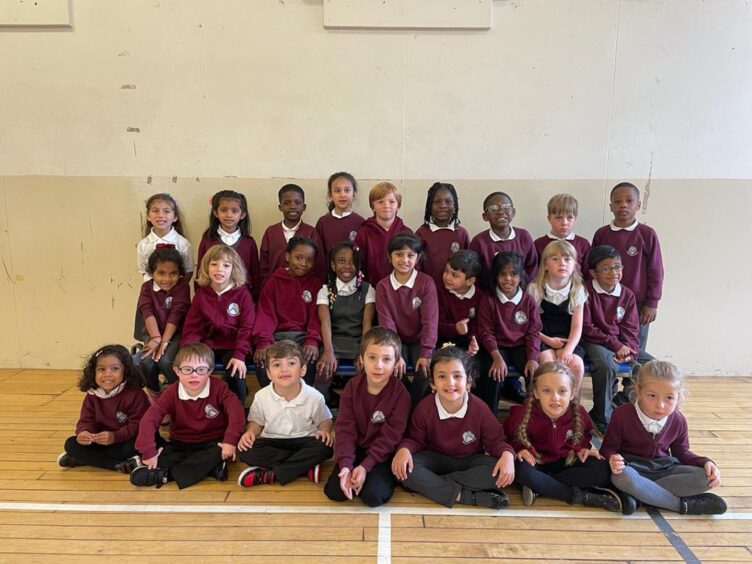 First class of 2023 at Skene Square Primary School in Aberdeen in three rows in the PE hall