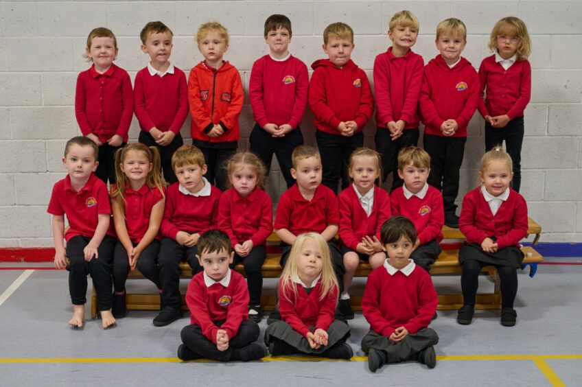 First class of 2023 at South Lodge Primary in the highlands and islands, in three rows in their PE hall