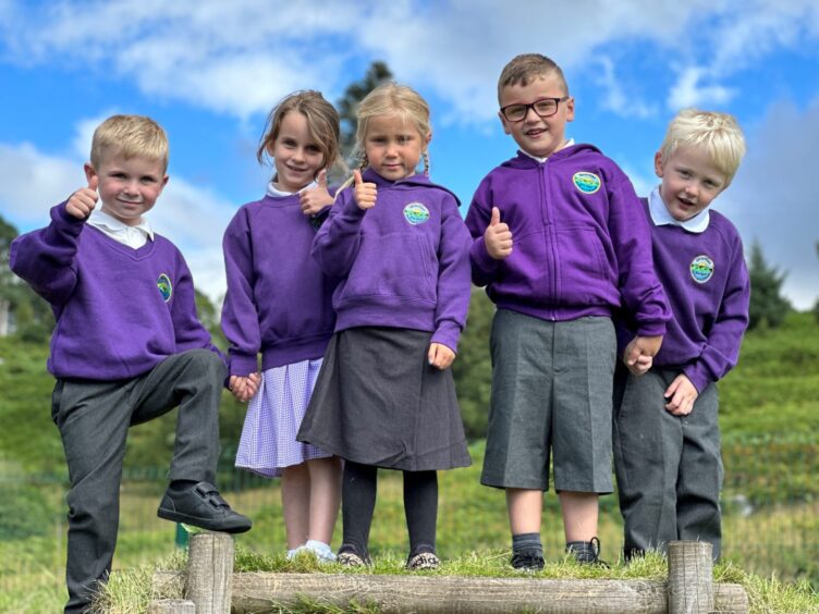 First class of 2023 at Strontian Primary School in the Highlands and Islands, the five pupils are pictured standing outside with their thumbs up