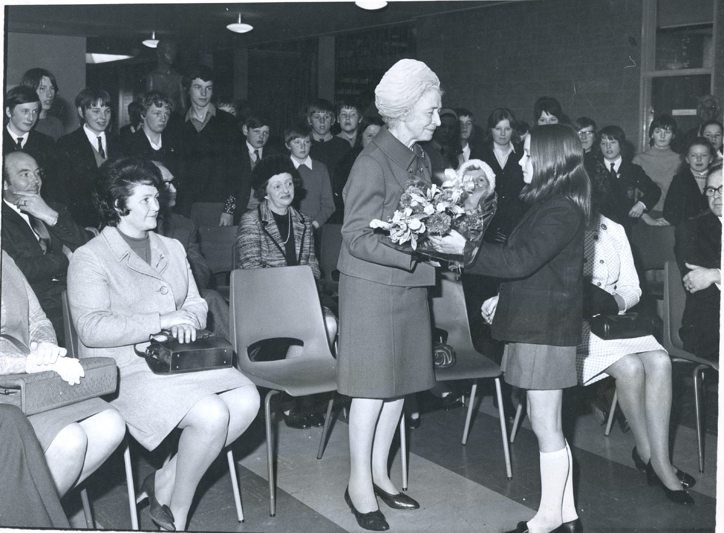 12-year-old pupil Yvonne Craib presenting Lady Aline Robertson with a bouquet on the occasion of another plaque being unveiled to commemorate the school opening in 1962.