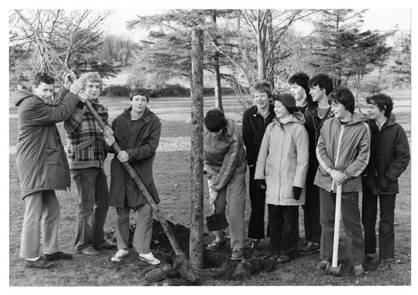 Fourth-year pupils of Summerhill Academy show their classmates how to plant a tree. 