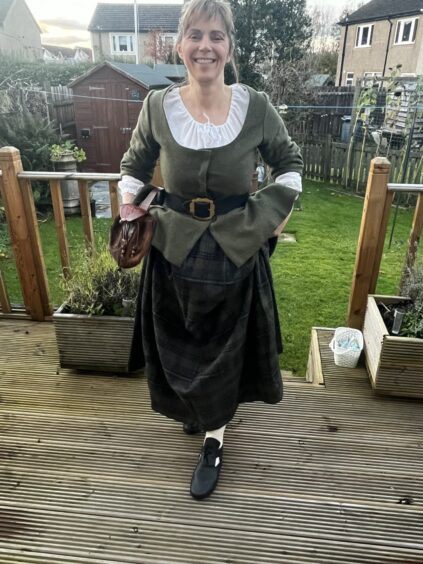 John's wife Susan modelling the first 18th century shoes he ever made.