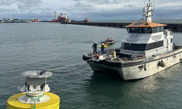 The Oasis Power Buoy transferring power to the CTV GXS Viking off Peterhead.