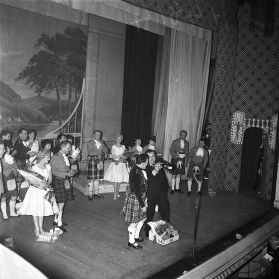 Brian Hendry (centre) says farewell to the crowd and the theatre in an emotional affair. Supplied by DCT Archives.