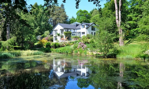 Dunlin House at Dalmuinzie Road comes with two acres of garden, wood and a pond. Image: Ledingham Chalmers LLP