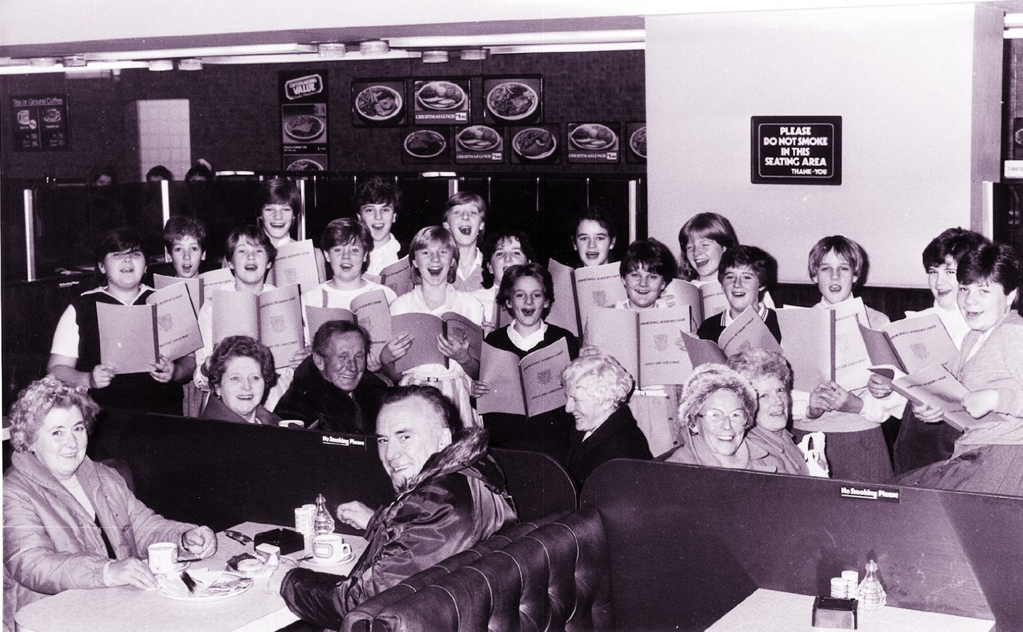 Summerhill Academy second-year choir carol singing in Littlewoods restaurant, Aberdeen, at Christmas 1983.