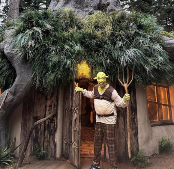 Taika Waititi dressed as Shrek at a Shrek-themed Airbnb in Scotland