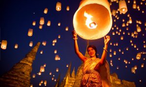 Thai woman enjoying yee peng festival in Ayutthaya