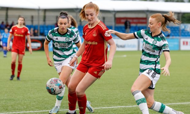 Aberdeen Women midfielder Eilidh Shore battles with Celtic's Amy Gallacher and Jenny Smith in a SWPL match.