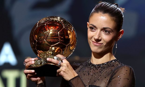 Aitana Bonmati lifts the Ballon d'Or trophy after being named the best female player for the 2022-23 season.