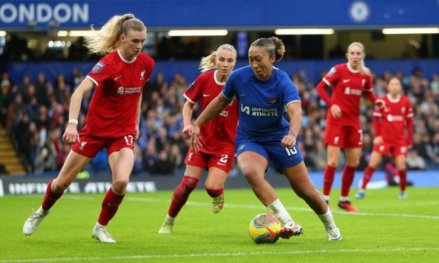 Chelsea forward Lauren James, right, takes on Liverpool defender Jenna Clark in a WSL match at Stamford Bridge.