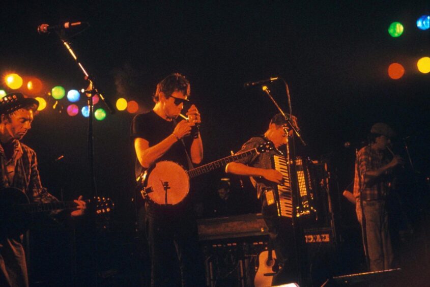 Shane MacGown fronting The Pogues in an unidentified venue in 1988. Image: Fotex/Shutterstock