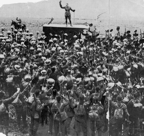 Cheering crowds of soldiers on Armistice Day November 1918. 