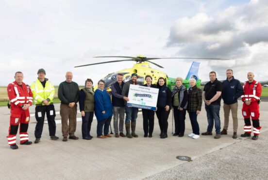 Farmers’ Choir singers joined by RSABI chair, Jimmy McLean, RSABI and SCAA staff, United Auctions representative, Judith Murray, and farmer and comedian, Jim Smith.