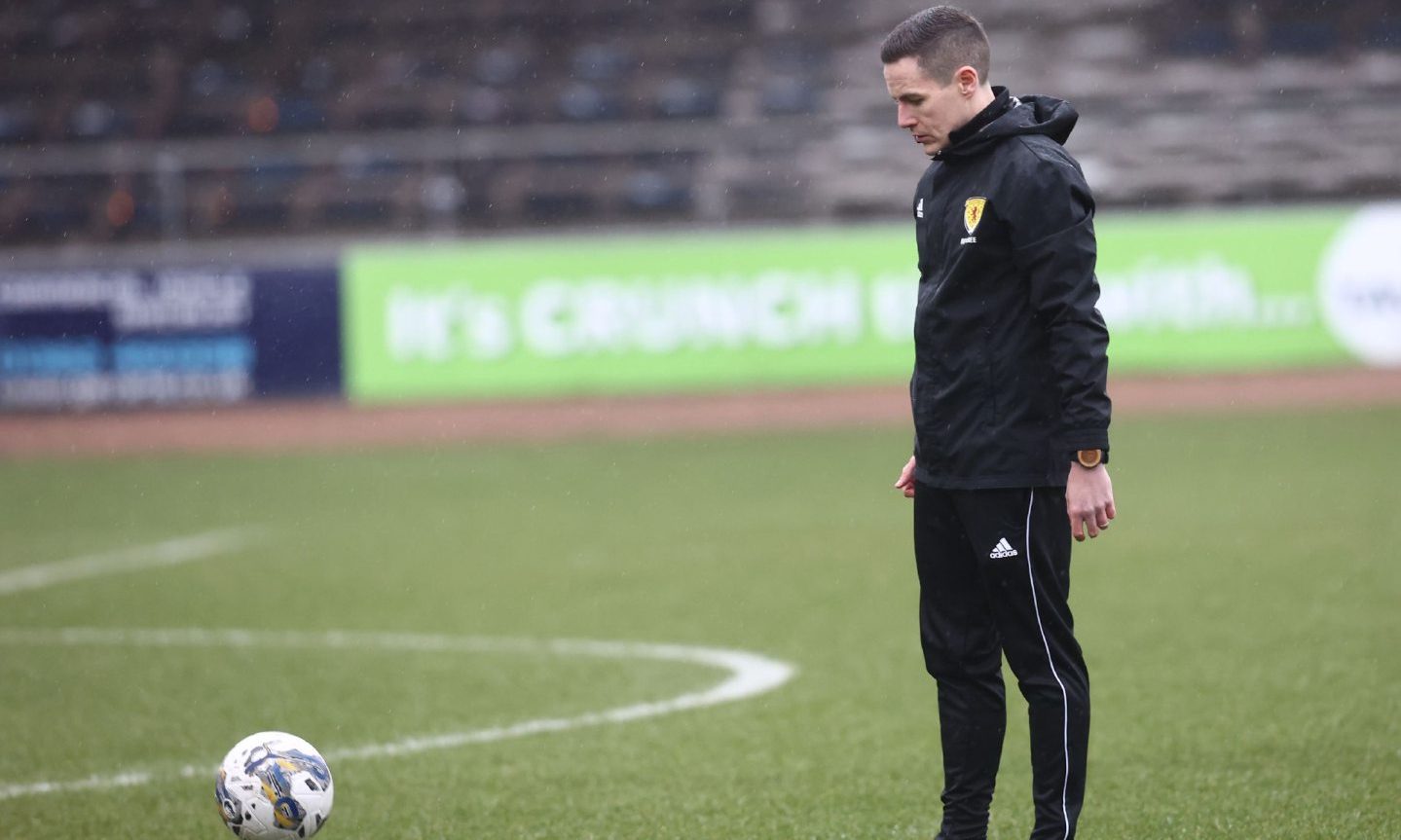 Referee David Munro inspects the pitch ahead of Aberdeen's match with Dundee at Dens Park. Image; Shutterstock