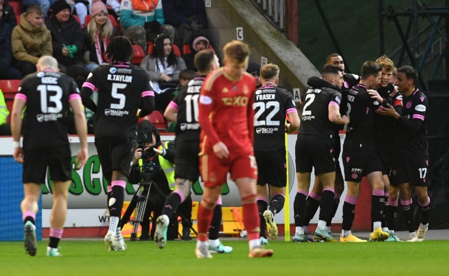 St Mirren players celebrate a goal by Mark O'Hara in the Premiership match against Aberdeen at Pittodrie. Image: Shutterstock