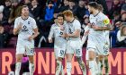 Yan Dhanda of Ross County is congratulated by his team-mates after his free-kick to put the Staggies 2-0 up at Hearts. Image: Shutterstock.