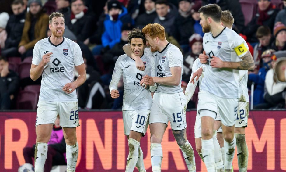 Yan Dhanda of Ross County is congratulated by his team-mates after his free-kick to put the Staggies 2-0 up at Hearts.