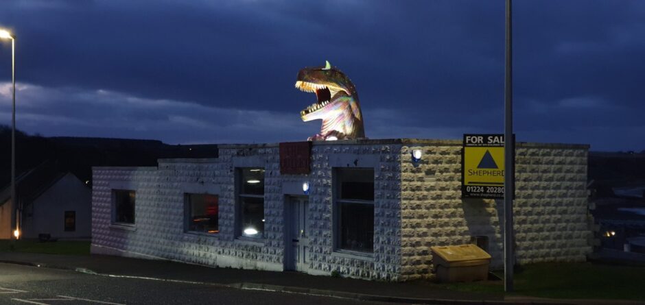 The Cullen shop and its dinosaur.