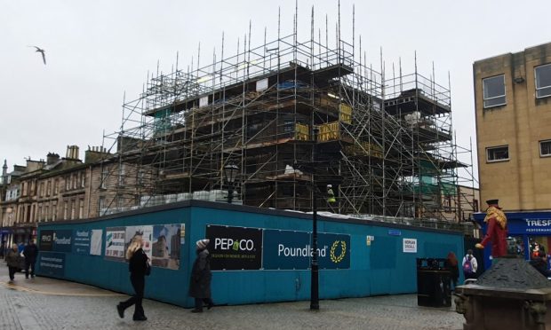 Poundland building in Elgin surrounded by scaffolding.