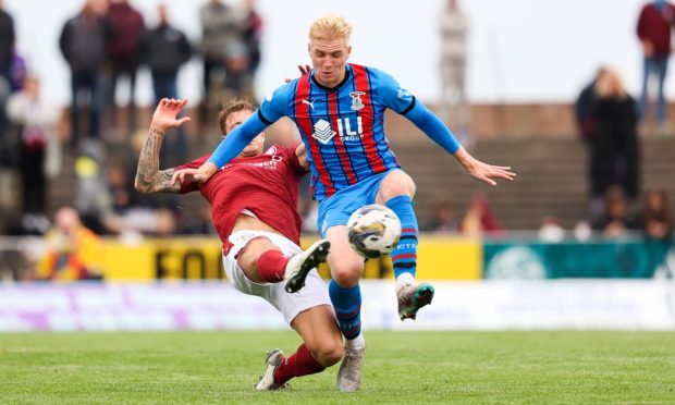 Luis Longstaff, front, in action for Caley Thistle against Arbroath.