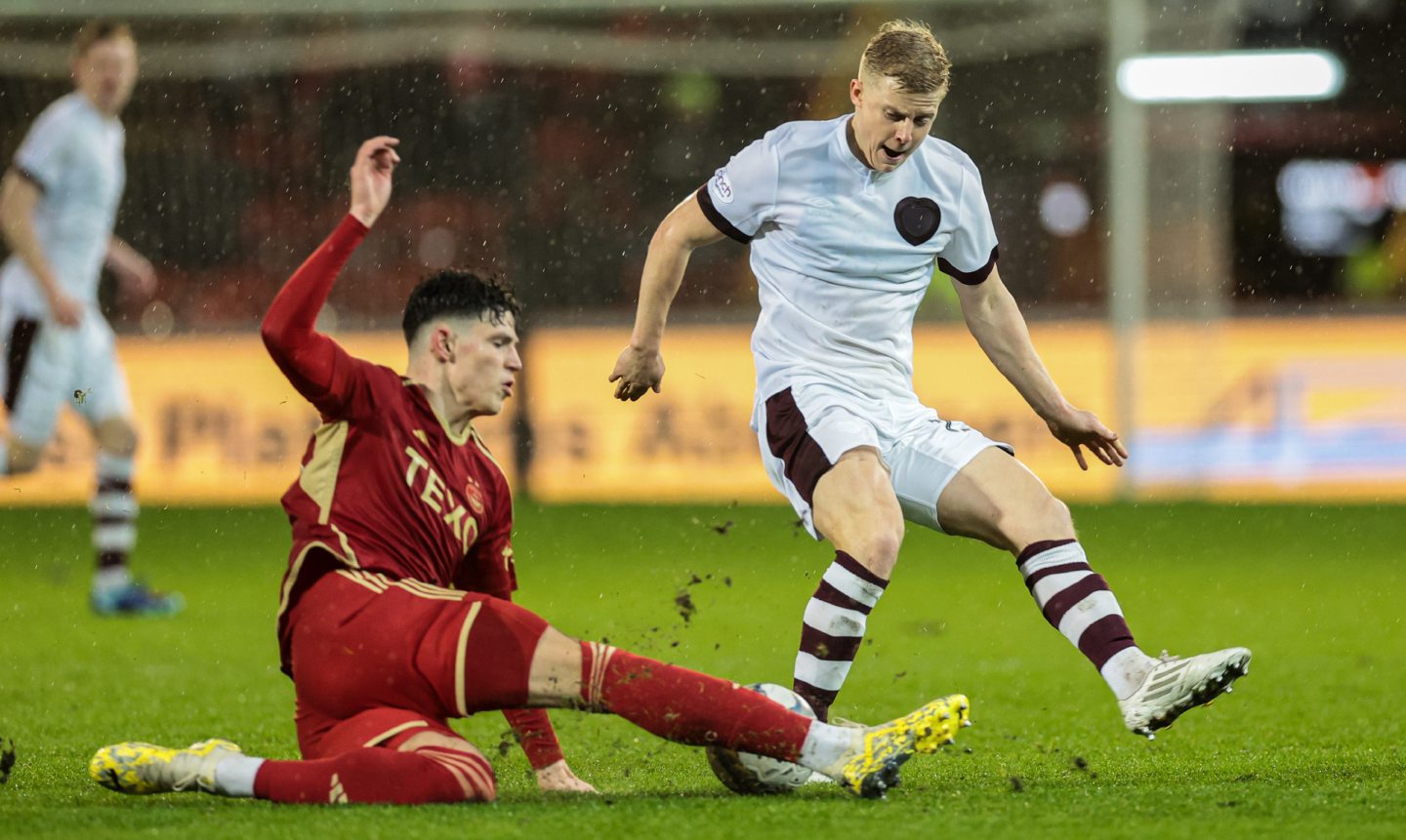 Aberdeen's Jack Milne and Hearts' Alex Cochrane in action at Pittodrie
