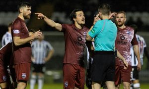 Ross County's James Brown protests following St Mirren's opening goal. Image: SNS
