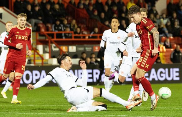 Aberdeen's James McGarry and Frankfurt's Robin Koch. Image; SNS.