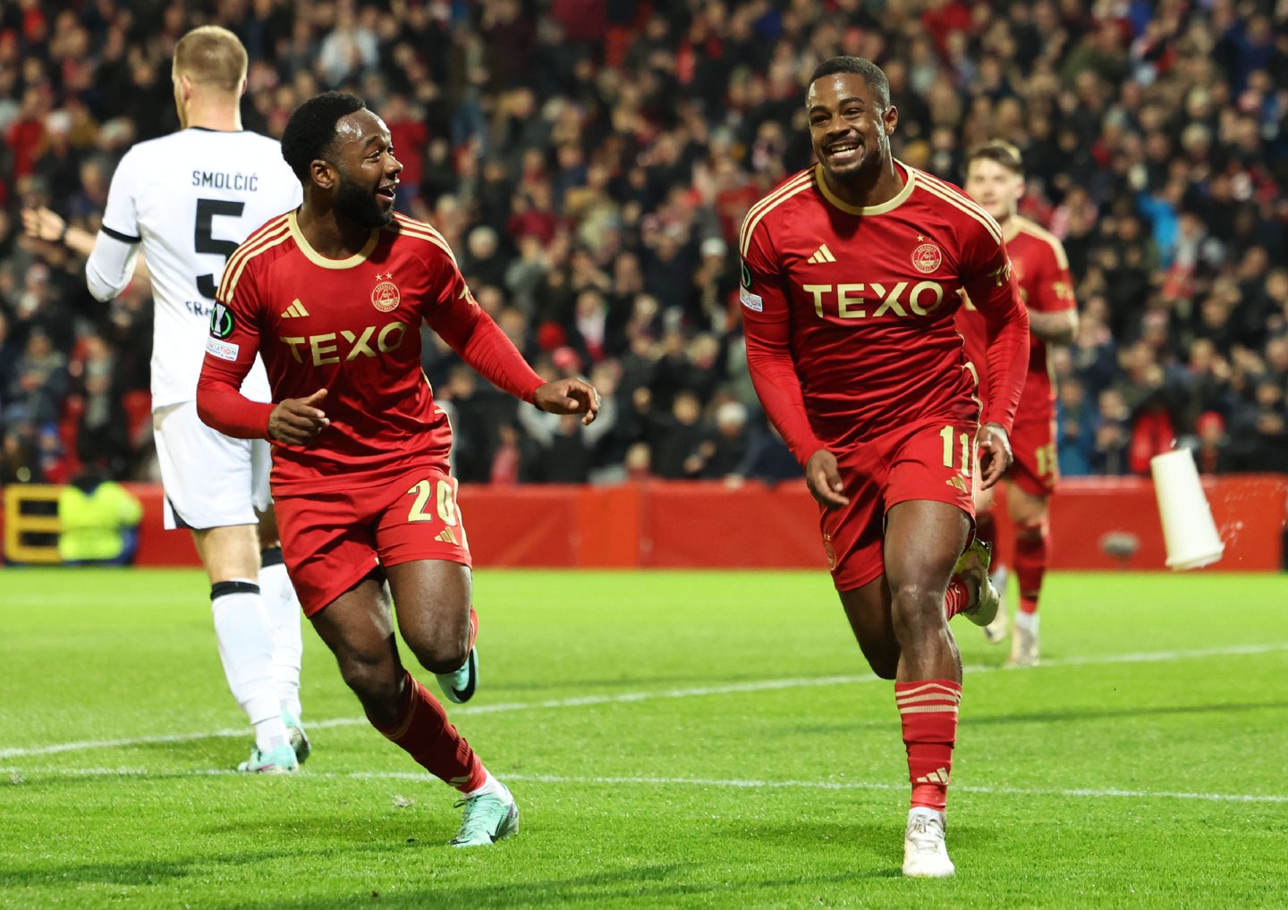 Aberdeen's Duk Luis Lopes (no. 11) celebrates with Shayden Morrris after scoring to make it 1-0 in a Europa Conference League match against Eintracht Frankfurt at Pittodrie. Image; SNS 