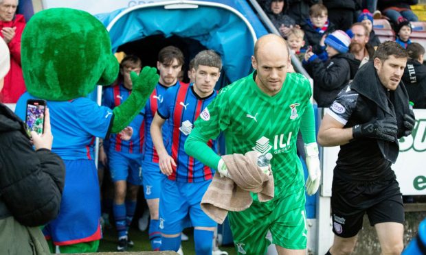 Caley Thistle goalkeeper Mark Ridgers leads his team out against Arbroath.