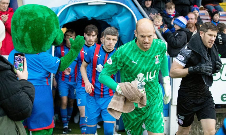 Caley Thistle goalkeeper Mark Ridgers leads his team out against Arbroath.