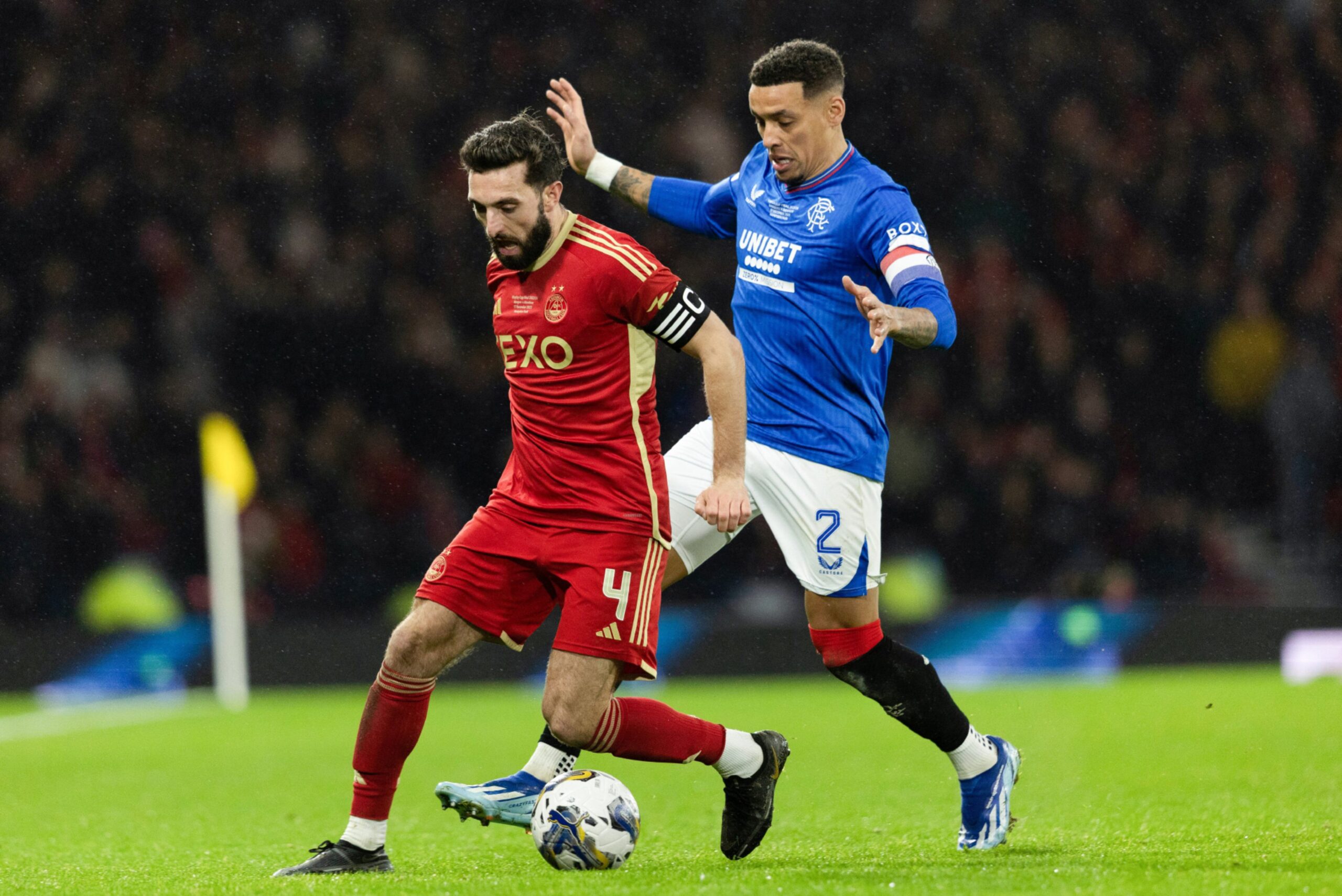 Aberdeen's Graeme Shinnie and Rangers' James Tavernier competing for the ball