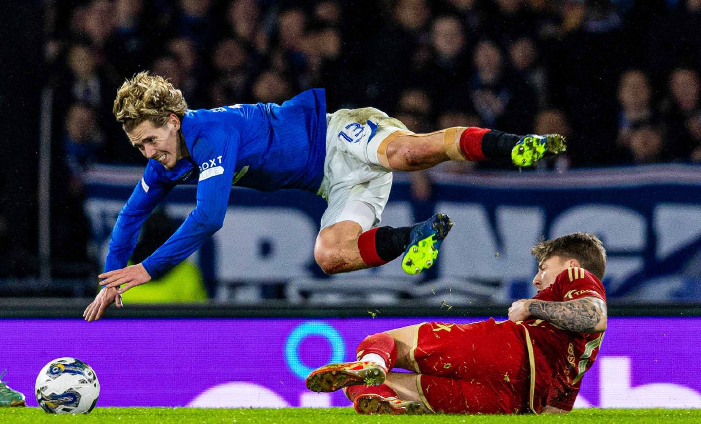  Aberdeen's James McGarry tackles Rangers' Todd Cantwell during the Viaplay Cup final at Hampden. Image: SNS 