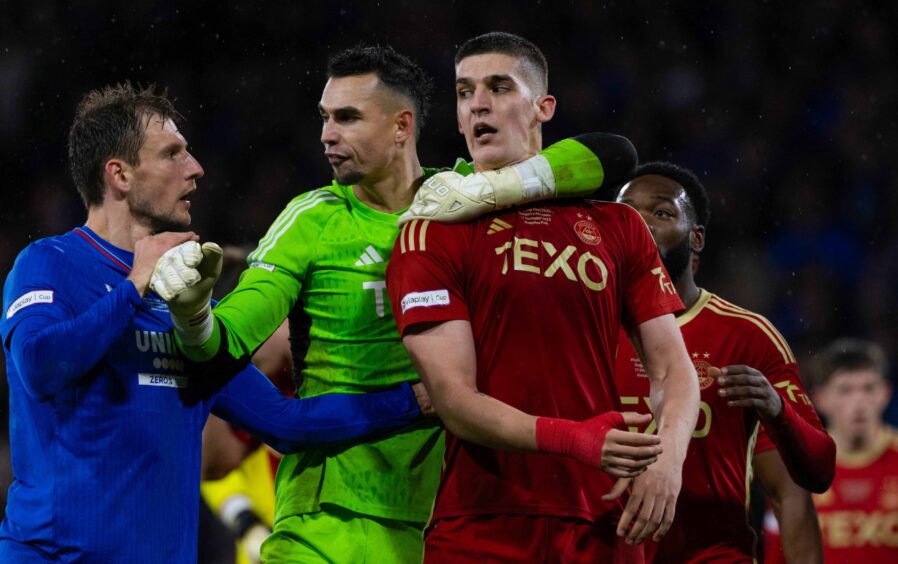 Rangers' Borna Barisic confronts Aberdeen's Slobodan Rubezic in the final moments of the Viaplay Cup final. Image: SNS.