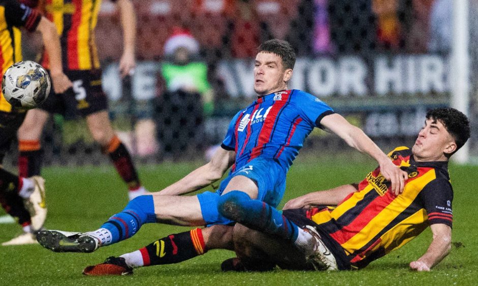Inverness' Charlie Gilmour (C) and Partick's Lewis Neilson in action. Image: SNS.