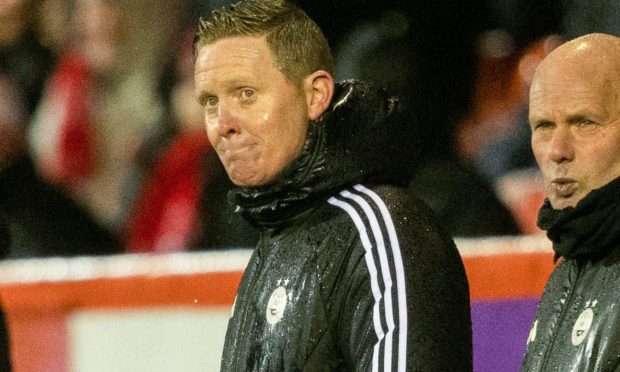 Dons manager Barry Robson looks dejected during the 3-0 loss to St Mirren in the Premiership at Pittodrie.